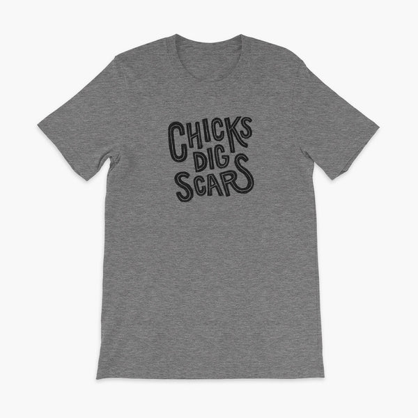 Black textured and distressed hand lettered typography that says chicks dig scars on a slate t-shirt