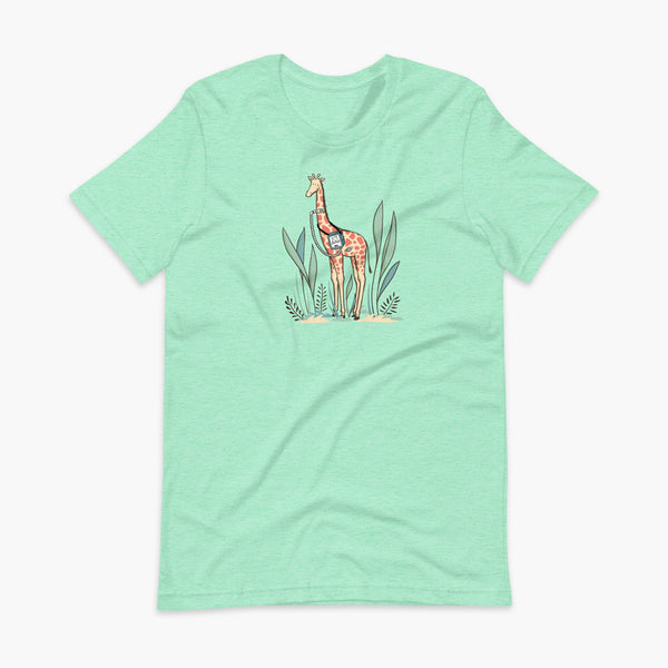 A giraffe with a trach or tracheostomy and a ventilator and g-tube mic-key button standing in a shrubbery with a stoma on a heather mint adult t-shirt
