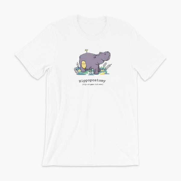 A Hippo or Hippopotamus with an ostomy bag — also known as a Hippopostomy. He is standing in some foliage smiling and has a bird on his back on a white adult t-shirt.