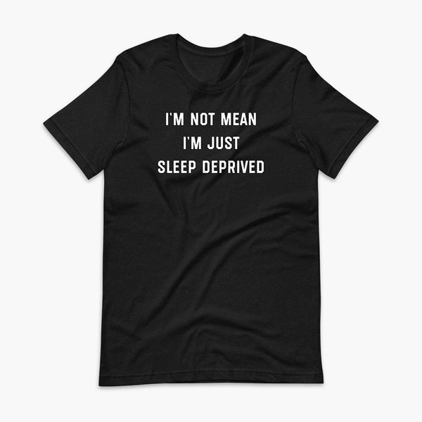 Stacked white text that says I’m Not Mean I’m Just Sleep Deprived  - for living the tired tracheostomy, tubie or trach life with a stoma on a black adult t-shirt 