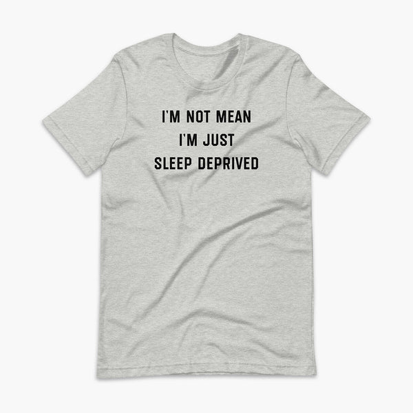 Stacked black text that says I’m Not Mean I’m Just Sleep Deprived  - for living the tired tracheostomy, tubie or trach life with a stoma on a athletic heather grey adult t-shirt 