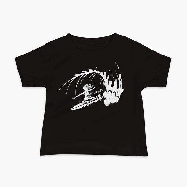 A white block print style illustration of a young kid surfing in a wave, getting tubed or barreled and he has a g-tube flowing from his stomach as he flies down the line on a black infant t-shirt