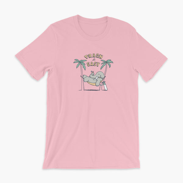 An elephant with a trach or tracheostomy and connected to an oxygen tank sits in a hammock between two palm trees with his nose around a drink just trachin’ it easy and relaxing on a pink adult t-shirt