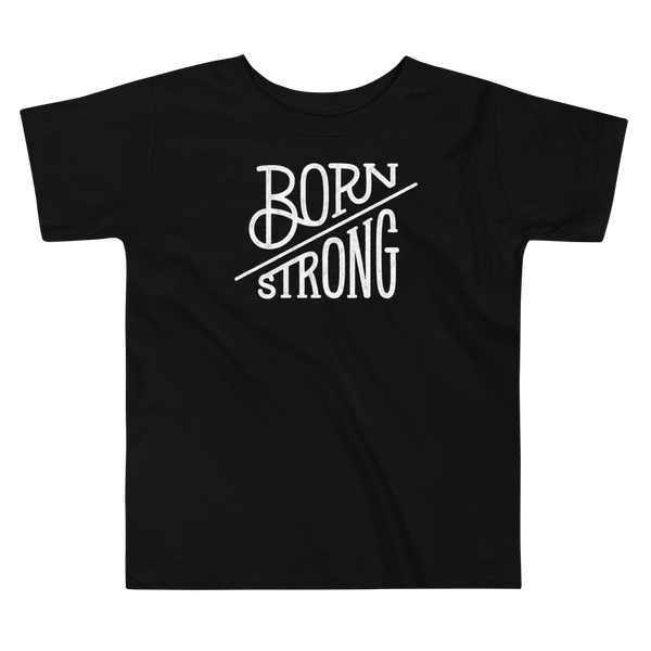 The text Born Strong on a kids black T-Shirt  by StomaStoma for g-tube and trach life empowerment.