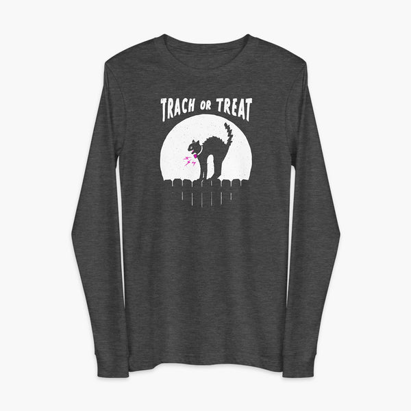A white cat with a trach or tracheostomy and a PMV or Passy Muir valve with the word "TRACH OR TREAT" in white letter across the chest. The black cat is standing on top of a fence, silhouetted by the moon for Halloween. It is on a black heather grey adult long sleeve shirt.