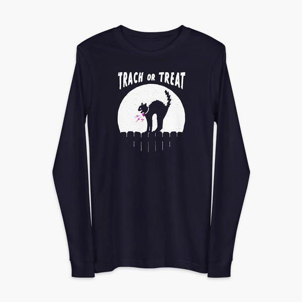 A white cat with a trach or tracheostomy and a PMV or Passy Muir valve with the word "TRACH OR TREAT" in white letter across the chest. The black cat is standing on top of a fence, silhouetted by the moon for Halloween. It is on a navy adult long sleeve shirt.