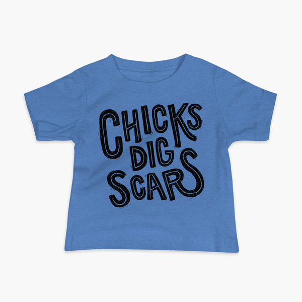 Black textured and distressed hand lettered typography that says chicks dig scars on a blue t-shirt