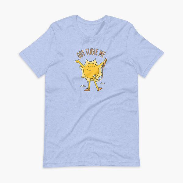 A happy sun stands confidently in tennis shoes holding a g-tube or a gastronomy tube with a stoma for StomaStoma with the text Got Tubie Me above him on an adult heather blue t-shirt 