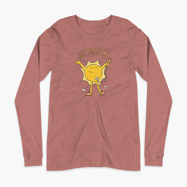 A happy sun stands confidently in tennis shoes holding a g-tube or a gastronomy tube with a stoma for StomaStoma with the text Got Tubie Me above him on an adult heather mauve long sleeve t-shirt 
