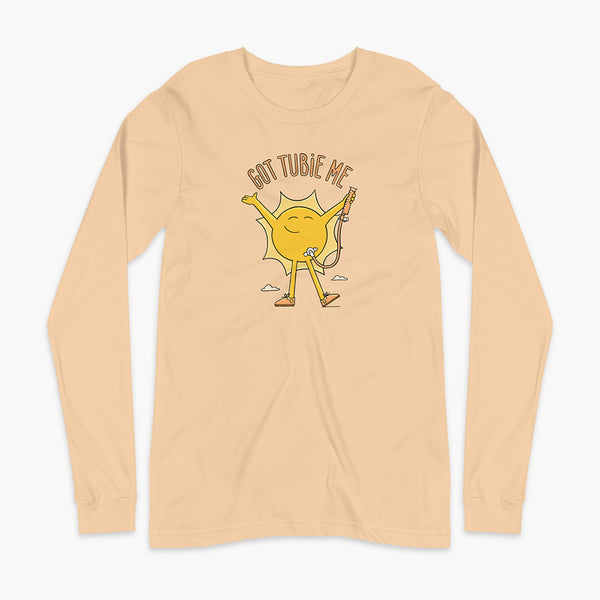 A happy sun stands confidently in tennis shoes holding a g-tube or a gastronomy tube with a stoma for StomaStoma with the text Got Tubie Me above him on an adult sand dune long sleeve t-shirt 
