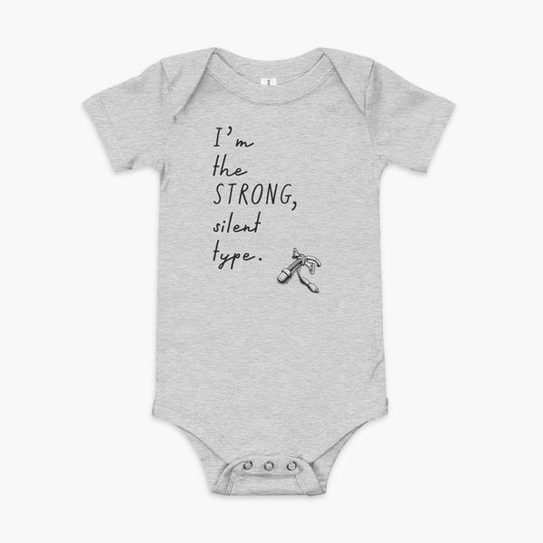 Handwritten text that say I’m the Strong Silent Type with an illustration of a trach - a bivona flextend trach with a cuff on an athletic heather infant onesie