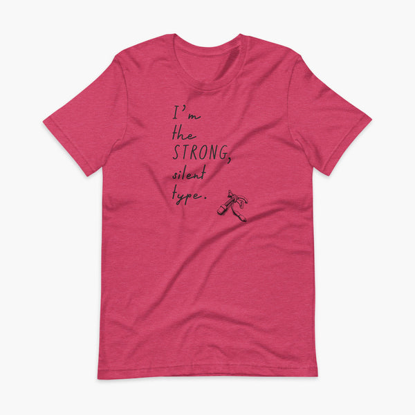 Handwritten text that say I’m the Strong Silent Type with an illustration of a trach - a bivona flextend trach with a cuff on a heather raspberry adult t-shirt