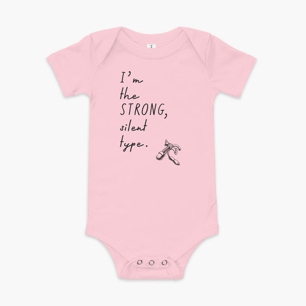 Handwritten text that say I’m the Strong Silent Type with an illustration of a trach - a bivona flextend trach with a cuff on a pink infant onesie