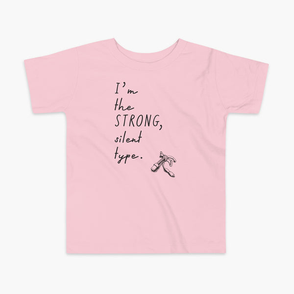Handwritten text that say I’m the Strong Silent Type with an illustration of a trach - a bivona flextend trach with a cuff on a pink kids t-shirt