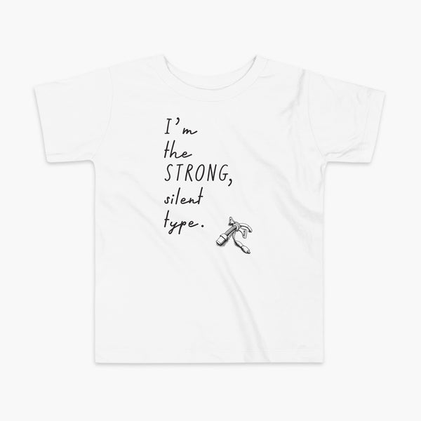 Handwritten text that say I’m the Strong Silent Type with an illustration of a trach - a bivona flextend trach with a cuff on a white kids t-shirt