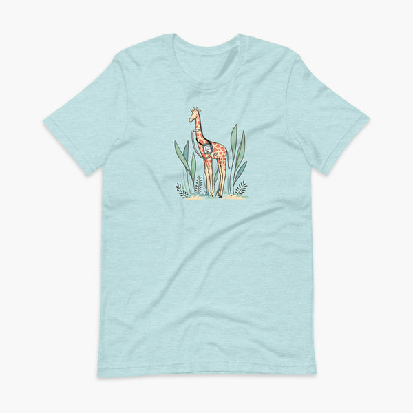 A giraffe with a trach or tracheostomy and a ventilator and g-tube mic-key button standing in a shrubbery with a stoma on a heather ice blue adult t-shirt