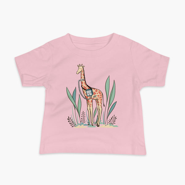 A giraffe with a trach or tracheostomy and a ventilator and g-tube mic-key button standing in a shrubbery with a stoma on a pink infant t-shirt