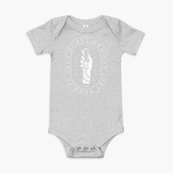Text that says Sometimes You Just Need To Vent wrapping around a hand holding a syringe or venting tube that is connected to a g-tube or gastronomy tube and mic-key button. There is additional text that says StomaStoma and Tube Life. On a heather athletic grey  infant onesie