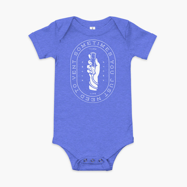 Text that says Sometimes You Just Need To Vent wrapping around a hand holding a syringe or venting tube that is connected to a g-tube or gastronomy tube and mic-key button. There is additional text that says StomaStoma and Tube Life. On a heather blue  infant onesie