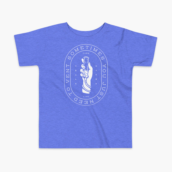 Text that says Sometimes You Just Need To Vent wrapping around a hand holding a syringe or venting tube that is connected to a g-tube or gastronomy tube and mic-key button. There is additional text that says StomaStoma and Tube Life. On a heather blue kids t-shirt