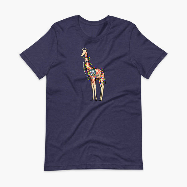 A Christmas giraffe with a trach or tracheostomy and a ventilator and g-tube mic-key button standing in a shrubbery covered in strings of Christmas lights with a stoma on a heather midnight navy adult t-shirt
