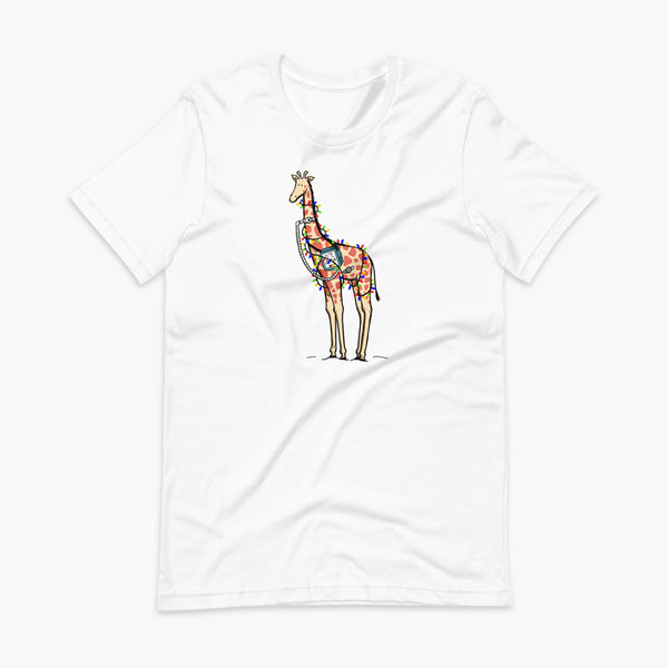 A Christmas giraffe with a trach or tracheostomy and a ventilator and g-tube mic-key button standing in a shrubbery covered in strings of Christmas lights with a stoma on a white adult t-shirt