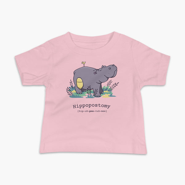 A Hippo or Hippopotamus with an ostomy bag — also known as a Hippopostomy. He is standing in some foliage smiling and has a bird on his back on a pink infant t-shirt.