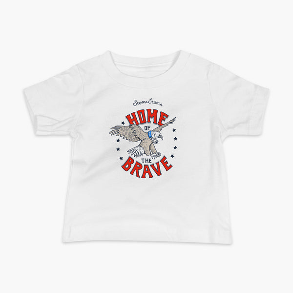 A patriotic American bald eagle with a trach or tracheostomy for the 4th of July and the words StomaStoma Home of the Brave and stars on a white infant t-shirt