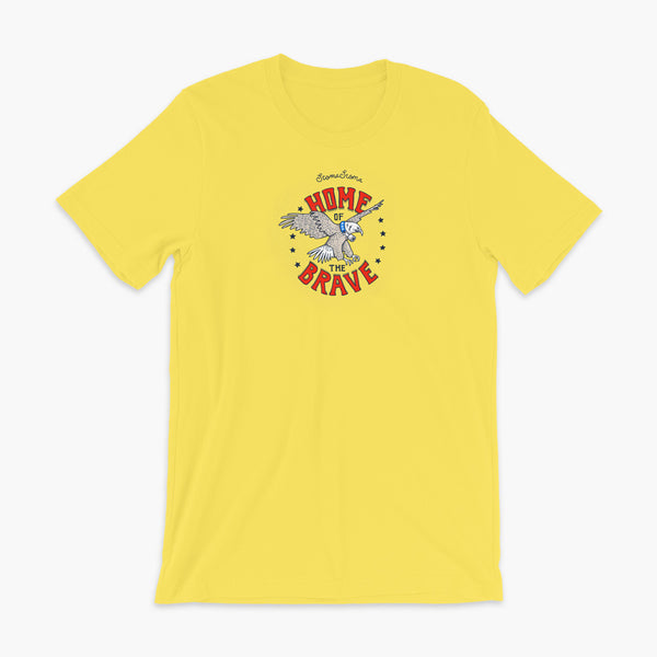 A patriotic American bald eagle with a trach or tracheostomy for the 4th of July and the words StomaStoma Home of the Brave and stars on a yellow adult t-shirt
