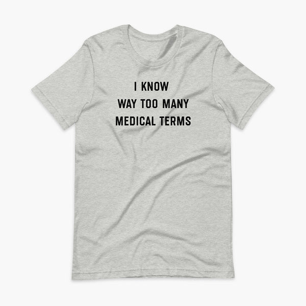 Stacked black text that says I know way too many medical terms  - for living the medically complex tracheostomy, tubie or trach life with a stoma on a athletic heather grey adult t-shirt 