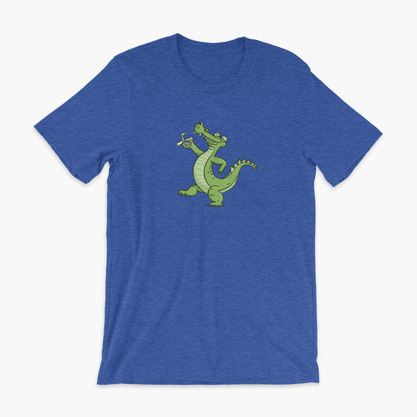 A green alligator or crocodile walks confidently with a big smile after bing decannulated of trach free. It is holding the trach in his hand. One a heather true royal adult t-shirt