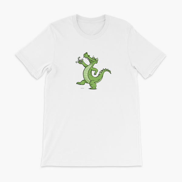 A green alligator or crocodile walks confidently with a big smile after bing decannulated of trach free. It is holding the trach in his hand. One a white adult t-shirt