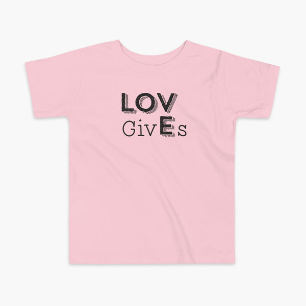 The word Love has given its “E” to the the word Gives. So it says Lov givEs on a pink kids t-shirt.