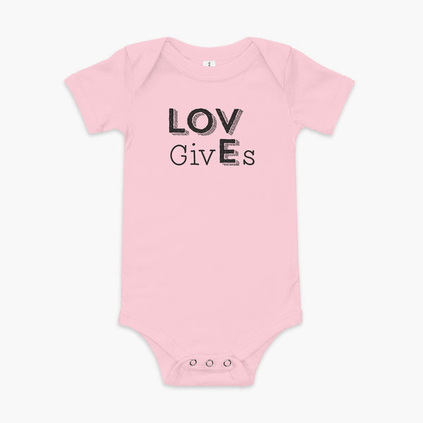 The word Love has given its “E” to the the word Gives. So it says Lov givEs on a pink infant onesie.