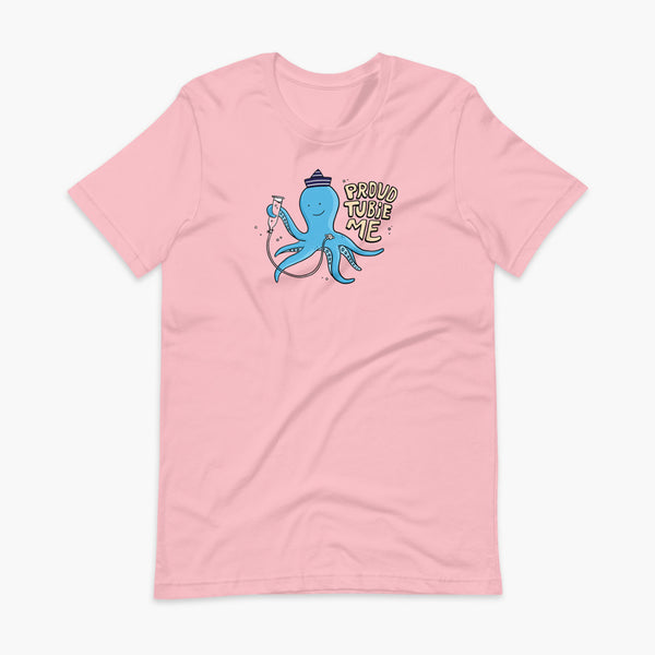 An octopus with a g-tube or gastronomy tube holding a feeding syringe doing a gravity feed in the ocean or underwater using his FreeArm feeding assistant with a stoma on a pink adult t-shirt