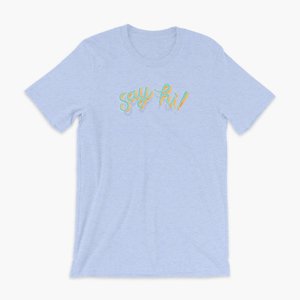 Floating say hi! script text on a heather blue adult t-shirt