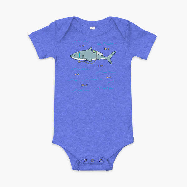 A Great White Shark with a trach or tracheostomy and tubing that goes to an oxygen or 02 tank on his back. swimming in the ocean with fish on a heather blue infant onesie
