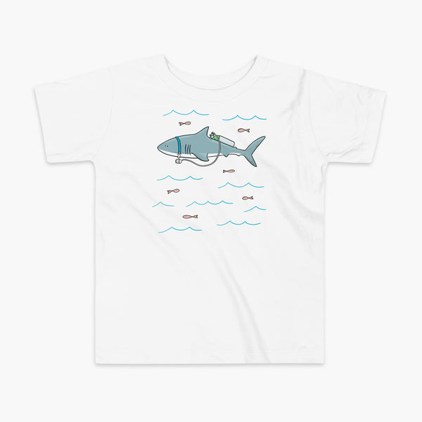 A Great White Shark with a trach or tracheostomy and tubing that goes to an oxygen or 02 tank on his back. swimming in the ocean with fish on a white kids t-shirt