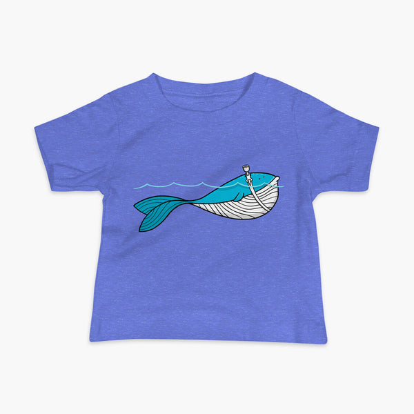 A blue whale with a trach or tracheostomy over his blow hole is happy and swimming in the water or ocean while living the trach life with his stoma on an infant columbia heather blue t-shirt