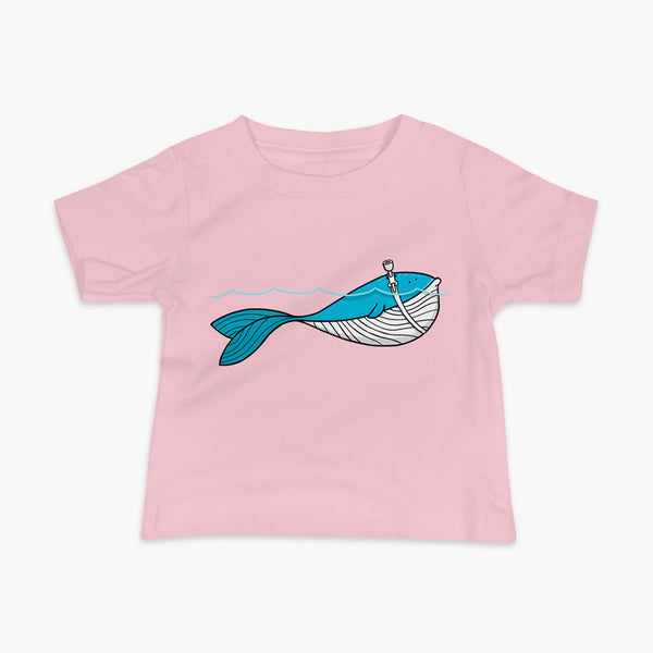A blue whale with a trach or tracheostomy over his blow hole is happy and swimming in the water or ocean while living the trach life with his stoma on an infant pink t-shirt