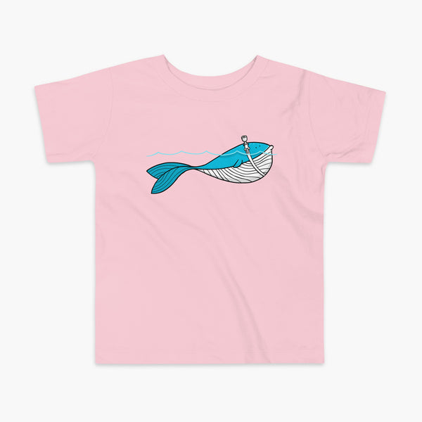A blue whale with a trach or tracheostomy over his blow hole is happy and swimming in the water or ocean while living the trach life with his stoma on a kids pink blue t-shirt