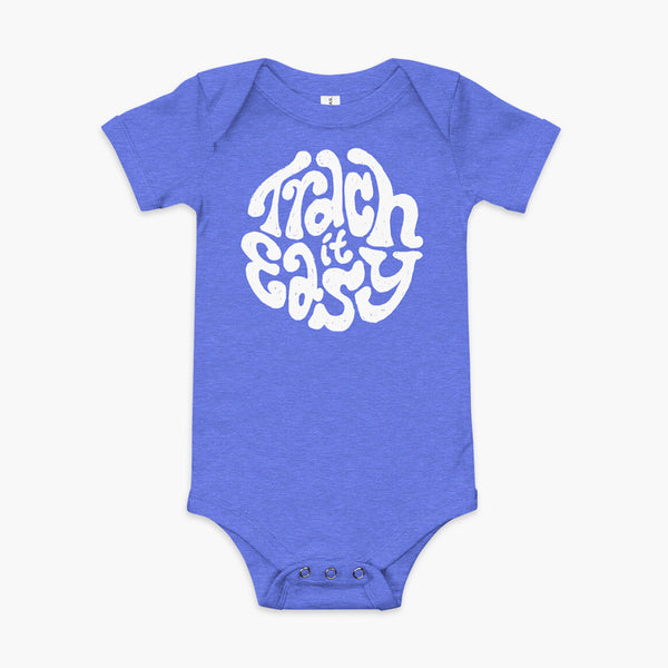 White text that says Trach It Easy for living the tracheostomy life with StomaStoma on a heather blue infant onesie