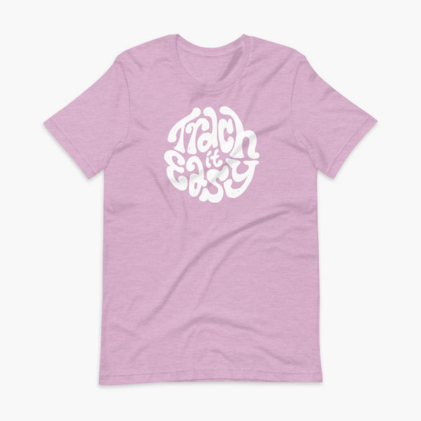 White text that says Trach It Easy for living the tracheostomy life with StomaStoma on a heather prims lilac adult t-shirt 