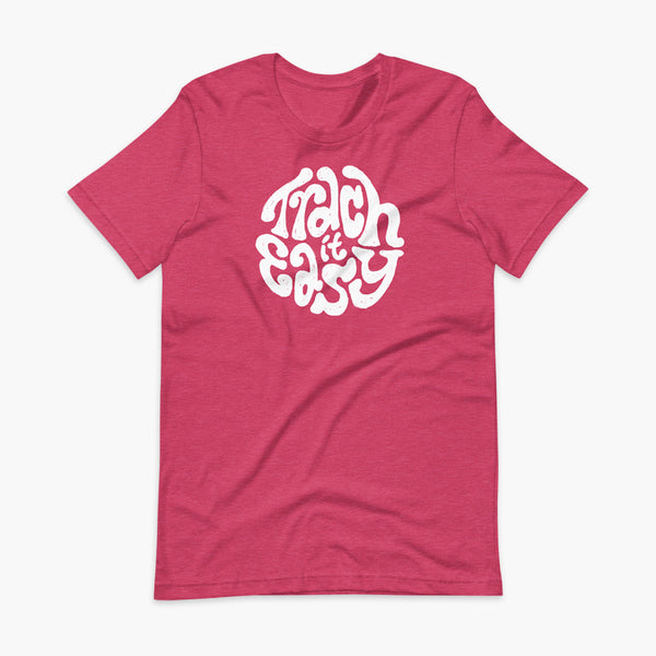 White text that says Trach It Easy for living the tracheostomy life with StomaStoma on a heather raspberry adult t-shirt 