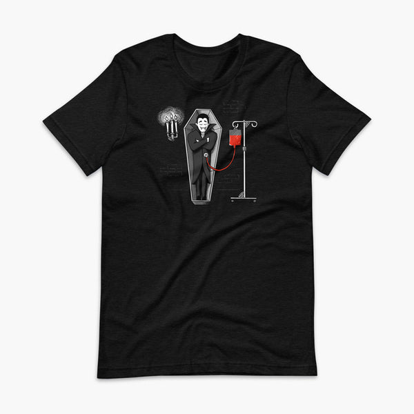 A halloween vampire is sleeping in a coffin in his castle and eating blood through a drip blood bag directly into his g-tube or gastronomy tube and g-tube mic-key a heather black adult t-shirt