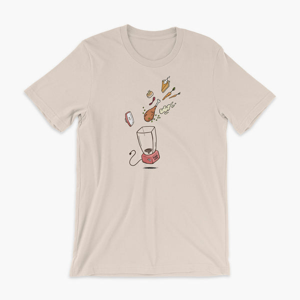 A Thanksgiving dinner getting thrown into a blender - a turkey leg, mashed potatoes, carrots, pumpkin pie and bread on a soft creme adult t-shirt. A meal for those who are living the Tube Life with a Stoma.