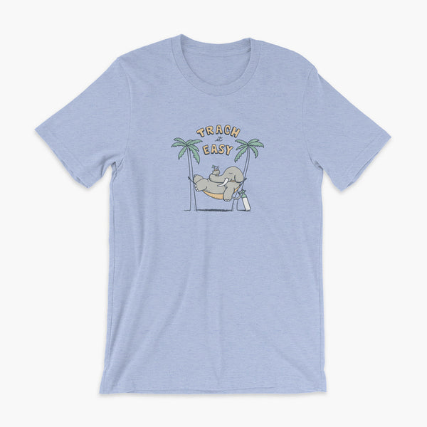 An elephant with a trach or tracheostomy and connected to an oxygen tank sits in a hammock between two palm trees with his nose around a drink just trachin’ it easy and relaxing on a heather blue adult t-shirt