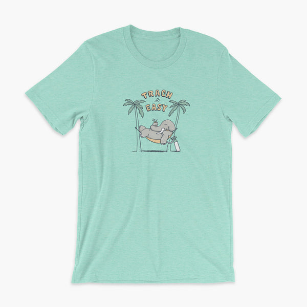 An elephant with a trach or tracheostomy and connected to an oxygen tank sits in a hammock between two palm trees with his nose around a drink just trachin’ it easy and relaxing on a heather mint adult t-shirt