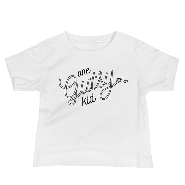 Script text that says one gutsy kid out of a g-tube or feeding tube in the stoma for a tubie life by StomaStoma on a white infant t-shirt