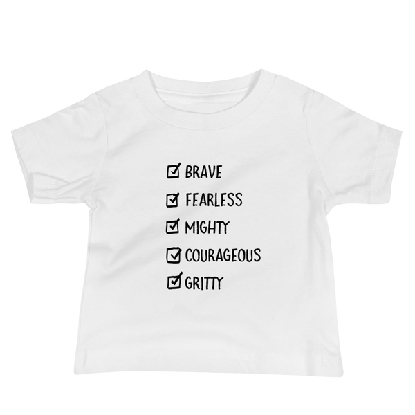 A checklist of text all checked off with the words brave, fearless, mighty, courageous, gritty on a white infant t-shirt